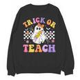 Trick Or Teach Groovy Halloween Teachers Unisex Sweatshirt, trending gift Trick Or Teach Groovy Halloween Teachers Unisex Sweatshirt, trending gift