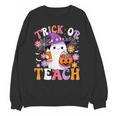 Trick Or Teach Groovy Teacher Ghost Halloween Teacher Unisex Sweatshirt, Groovy Teacher Gifts, trending gift