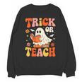 Trick Or Teach Halloween Shirt For Teacher Kids Floral Ghost Unisex Sweatshirt, trending gift Trick Or Teach Halloween Shirt For Teacher Kids Floral Ghost Unisex Sweatshirt, trending gift