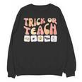 Trick Or Teach With Symbols Special Education Teacher Spooky Unisex Sweatshirt, trending gift Trick Or Teach With Symbols Special Education Teacher Spooky Unisex Sweatshirt, trending gift
