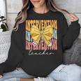 Interventionist Teacher Groovy Coquette Bow Back To School Unisex Sweatshirt, Groovy Teacher Gifts, funny design