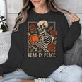 Read In Peace Skeleton Reading Book Halloween Teacher Unisex Sweatshirt, funny design Read In Peace Skeleton Reading Book Halloween Teacher Unisex Sweatshirt, funny design