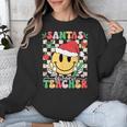 Santas Favorite Teacher Retro Groovy Smile Face Christmas Unisex Sweatshirt, Groovy Teacher Gifts, funny design Santas Favorite Teacher Retro Groovy Smile Face Christmas Unisex Sweatshirt, Groovy Teacher Gifts, funny design