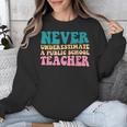 Never Underestimate A Public School Teacher Groovy Women Unisex Sweatshirt, Groovy Teacher Gifts, funny design Never Underestimate A Public School Teacher Groovy Women Unisex Sweatshirt, Groovy Teacher Gifts, funny design