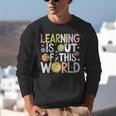 Learning Is Out Of This World Space Teacher Cute Groovy Unisex Sweatshirt, Groovy Teacher Sweatshirts, funny gift
