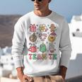 Team TK Teacher Christmas Groovy Smile Face Girl Boy Kid TK Unisex Sweatshirt, Groovy Teacher Sweatshirts, funny gift Team TK Teacher Christmas Groovy Smile Face Girl Boy Kid TK Unisex Sweatshirt, Groovy Teacher Sweatshirts, funny gift