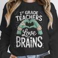 1st Grade Teachers Love Brains Shirt Halloween Teacher Unisex Sweatshirt, novelty gifts, funny gifts