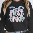 First Grade Coquette Bow Girls Teacher Team 1st Grade Squad Unisex Sweatshirt, novelty gifts, funny gifts