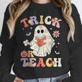 Groovy Halloween Trick Or Teach Retro Floral Ghost Teacher Unisex Sweatshirt, novelty gifts, funny gifts Groovy Halloween Trick Or Teach Retro Floral Ghost Teacher Unisex Sweatshirt, novelty gifts, funny gifts