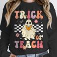 Groovy Teacher Halloween Retro Trick Or Teach Floral Ghost Unisex Sweatshirt, novelty gifts, funny gifts