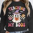 Groovy Teaching My Boos Teacher Ghost Halloween Teacher Unisex Sweatshirt, novelty gifts, funny gifts