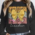 Interventionist Teacher Groovy Coquette Bow Back To School Unisex Sweatshirt, novelty gifts, funny gifts