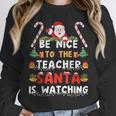 Be Nice To The Teacher Santa Is Watching Christmas Unisex Sweatshirt, novelty gifts, funny gifts Be Nice To The Teacher Santa Is Watching Christmas Unisex Sweatshirt, novelty gifts, funny gifts