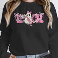 Pink Ghost Teach Halloween Teacher In Spooky Season Unisex Sweatshirt, novelty gifts, funny gifts Pink Ghost Teach Halloween Teacher In Spooky Season Unisex Sweatshirt, novelty gifts, funny gifts