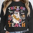 Retro Floral Ghost Trick Or Teach Groovy Teacher Halloween Unisex Sweatshirt, novelty gifts, funny gifts