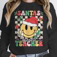 Santas Favorite Teacher Retro Groovy Smile Face Christmas Unisex Sweatshirt, novelty gifts, funny gifts Santas Favorite Teacher Retro Groovy Smile Face Christmas Unisex Sweatshirt, novelty gifts, funny gifts