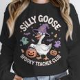 Silly Goose Spooky Teacher Club Halloween Witch Ghost Unisex Sweatshirt, novelty gifts, funny gifts Silly Goose Spooky Teacher Club Halloween Witch Ghost Unisex Sweatshirt, novelty gifts, funny gifts