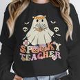 Spooky Teacher Groovy Retro Ghost Teacher Halloween 2023 For Men Women Kids Unisex Sweatshirt, novelty gifts, funny gifts Spooky Teacher Groovy Retro Ghost Teacher Halloween 2023 For Men Women Kids Unisex Sweatshirt, novelty gifts, funny gifts