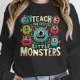 I Teach The Cutest Little Monsters Teacher Halloween Outfit Unisex Sweatshirt, novelty gifts, funny gifts I Teach The Cutest Little Monsters Teacher Halloween Outfit Unisex Sweatshirt, novelty gifts, funny gifts