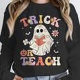 Teacher Halloween Trick Or Teach Floral Ghost Unisex Sweatshirt, novelty gifts, funny gifts Teacher Halloween Trick Or Teach Floral Ghost Unisex Sweatshirt, novelty gifts, funny gifts