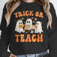 Teacher Halloween Trick Or Teach Retro Groovy Floral Ghost Unisex Sweatshirt, novelty gifts, funny gifts