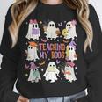 Teaching My Boos Teacher Cute Ghost Groovy Teacher Halloween Unisex Sweatshirt, novelty gifts, funny gifts Teaching My Boos Teacher Cute Ghost Groovy Teacher Halloween Unisex Sweatshirt, novelty gifts, funny gifts