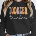 Toddler Teacher Retro Groovy Women Happy First Day Of School Unisex Sweatshirt, novelty gifts, funny gifts Toddler Teacher Retro Groovy Women Happy First Day Of School Unisex Sweatshirt, novelty gifts, funny gifts