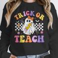 Trick Or Teach Groovy Halloween Teachers Unisex Sweatshirt, novelty gifts, funny gifts Trick Or Teach Groovy Halloween Teachers Unisex Sweatshirt, novelty gifts, funny gifts