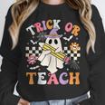 Trick Or Teach Groovy Teacher Halloween Retro Teacher Ghost Unisex Sweatshirt, novelty gifts, funny gifts
