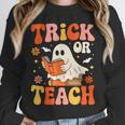 Trick Or Teach Halloween Shirt For Teacher Kids Floral Ghost Unisex Sweatshirt, novelty gifts, funny gifts Trick Or Teach Halloween Shirt For Teacher Kids Floral Ghost Unisex Sweatshirt, novelty gifts, funny gifts