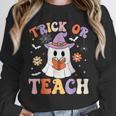 Trick Or Teach Teacher Groovy Ghost Halloween Teacher Unisex Sweatshirt, novelty gifts, funny gifts Trick Or Teach Teacher Groovy Ghost Halloween Teacher Unisex Sweatshirt, novelty gifts, funny gifts