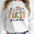 First Grade Teacher Wildflower Back To School Floral Outfits Unisex Sweatshirt, novelty gifts, funny gifts First Grade Teacher Wildflower Back To School Floral Outfits Unisex Sweatshirt, novelty gifts, funny gifts