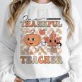 One Thankful Teacher Thanksgiving Groovy Fall Autumn Teacher Unisex Sweatshirt, novelty gifts, funny gifts One Thankful Teacher Thanksgiving Groovy Fall Autumn Teacher Unisex Sweatshirt, novelty gifts, funny gifts