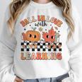 Retro Fall In Love With Learning Autumn Pumpkin Teacher Unisex Sweatshirt, novelty gifts, funny gifts Retro Fall In Love With Learning Autumn Pumpkin Teacher Unisex Sweatshirt, novelty gifts, funny gifts