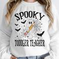 Spooky Toddler Teacher Halloween School Unisex Sweatshirt, novelty gifts, funny gifts Spooky Toddler Teacher Halloween School Unisex Sweatshirt, novelty gifts, funny gifts