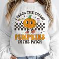 I Teach The Cutest Pumpkins In The Patch Groovy Teacher Fall Unisex Sweatshirt, novelty gifts, funny gifts