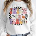 Trick Or Teach Retro Groovy Halloween Teacher Unisex Sweatshirt, novelty gifts, funny gifts Trick Or Teach Retro Groovy Halloween Teacher Unisex Sweatshirt, novelty gifts, funny gifts
