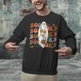 Booooks Ghost Halloween Groovy Vintage Teacher Book Reading Unisex Sweatshirt, Groovy Teacher Sweatshirts, gift for family, gift for coworker Booooks Ghost Halloween Groovy Vintage Teacher Book Reading Unisex Sweatshirt, Groovy Teacher Sweatshirts, gift for family, gift for coworker