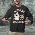 Daycare Boo Crew Groovy Halloween Floral Ghost Kid Teacher Unisex Sweatshirt, Groovy Teacher Sweatshirts, gift for family, gift for coworker