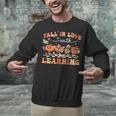 Fall In Love With Learning Autumn Teacher Thanksgiving Unisex Sweatshirt, gift for family, gift for coworker Fall In Love With Learning Autumn Teacher Thanksgiving Unisex Sweatshirt, gift for family, gift for coworker