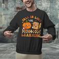 Fall In Love With Reading Book Autumn Pumpkins And Teachers Unisex Sweatshirt, gift for family, gift for coworker Fall In Love With Reading Book Autumn Pumpkins And Teachers Unisex Sweatshirt, gift for family, gift for coworker