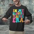 In My Glowing Teacher Era Groovy Colorful Bright Unisex Sweatshirt, Groovy Teacher Sweatshirts, gift for family, gift for coworker In My Glowing Teacher Era Groovy Colorful Bright Unisex Sweatshirt, Groovy Teacher Sweatshirts, gift for family, gift for coworker
