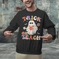Groovy Halloween Trick Or Teach Retro Floral Ghost Teacher Unisex Sweatshirt, Groovy Teacher Sweatshirts, gift for family, gift for coworker Groovy Halloween Trick Or Teach Retro Floral Ghost Teacher Unisex Sweatshirt, Groovy Teacher Sweatshirts, gift for family, gift for coworker