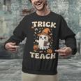 Halloween Teacher Shirts Women School Trick Or Teach Groovy Unisex Sweatshirt, Groovy Teacher Sweatshirts, gift for family, gift for coworker Halloween Teacher Shirts Women School Trick Or Teach Groovy Unisex Sweatshirt, Groovy Teacher Sweatshirts, gift for family, gift for coworker
