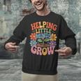 Helping Little Minds Grow Teacher First Day Back To School Unisex Sweatshirt, gift for family, gift for coworker Helping Little Minds Grow Teacher First Day Back To School Unisex Sweatshirt, gift for family, gift for coworker