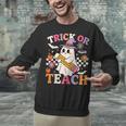 Retro Floral Ghost Trick Or Teach Groovy Teacher Halloween Unisex Sweatshirt, Groovy Teacher Sweatshirts, gift for family, gift for coworker