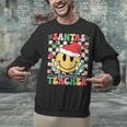 Santas Favorite Teacher Retro Groovy Smile Face Christmas Unisex Sweatshirt, Groovy Teacher Sweatshirts, gift for family, gift for coworker Santas Favorite Teacher Retro Groovy Smile Face Christmas Unisex Sweatshirt, Groovy Teacher Sweatshirts, gift for family, gift for coworker