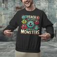 I Teach The Cutest Little Monsters Teacher Halloween Outfit Unisex Sweatshirt, gift for family, gift for coworker I Teach The Cutest Little Monsters Teacher Halloween Outfit Unisex Sweatshirt, gift for family, gift for coworker