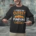 I Teach The Cutest Pumpkins In The Patch Halloween Teacher Unisex Sweatshirt, gift for family, gift for coworker I Teach The Cutest Pumpkins In The Patch Halloween Teacher Unisex Sweatshirt, gift for family, gift for coworker