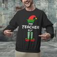 The Teacher Elf Family Matching Group Idea Christmas Unisex Sweatshirt, gift for family, gift for coworker The Teacher Elf Family Matching Group Idea Christmas Unisex Sweatshirt, gift for family, gift for coworker